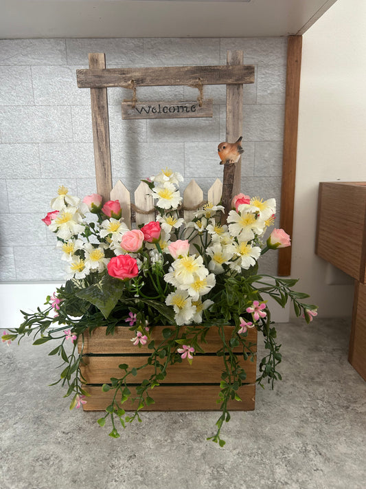 wooden welcome with flowers