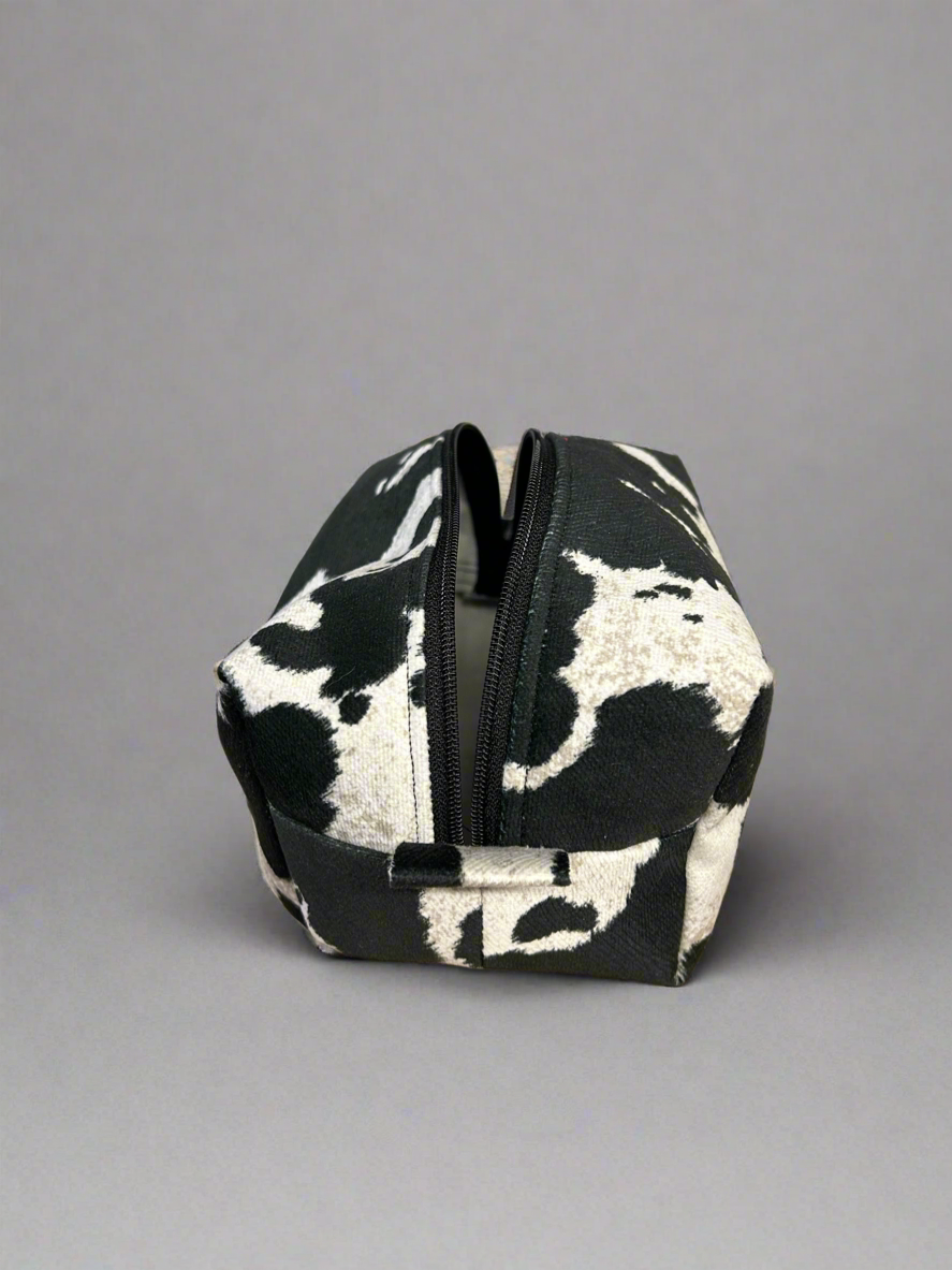 Cowhide look zippered pouch bag