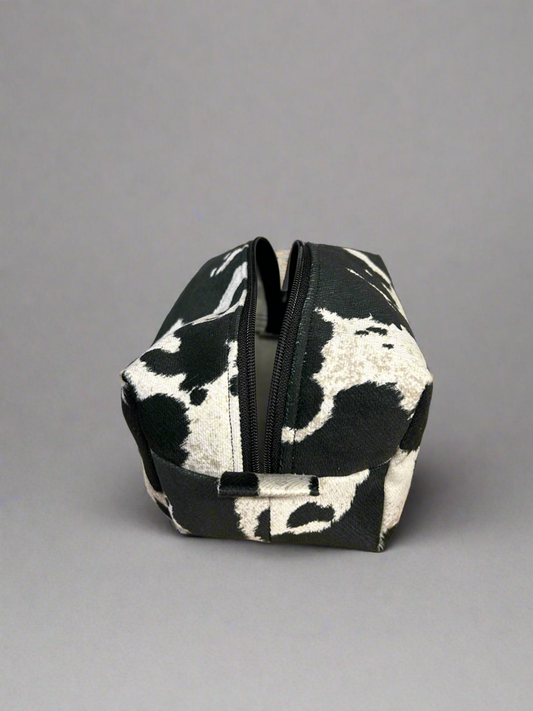 Cowhide look zippered pouch bag