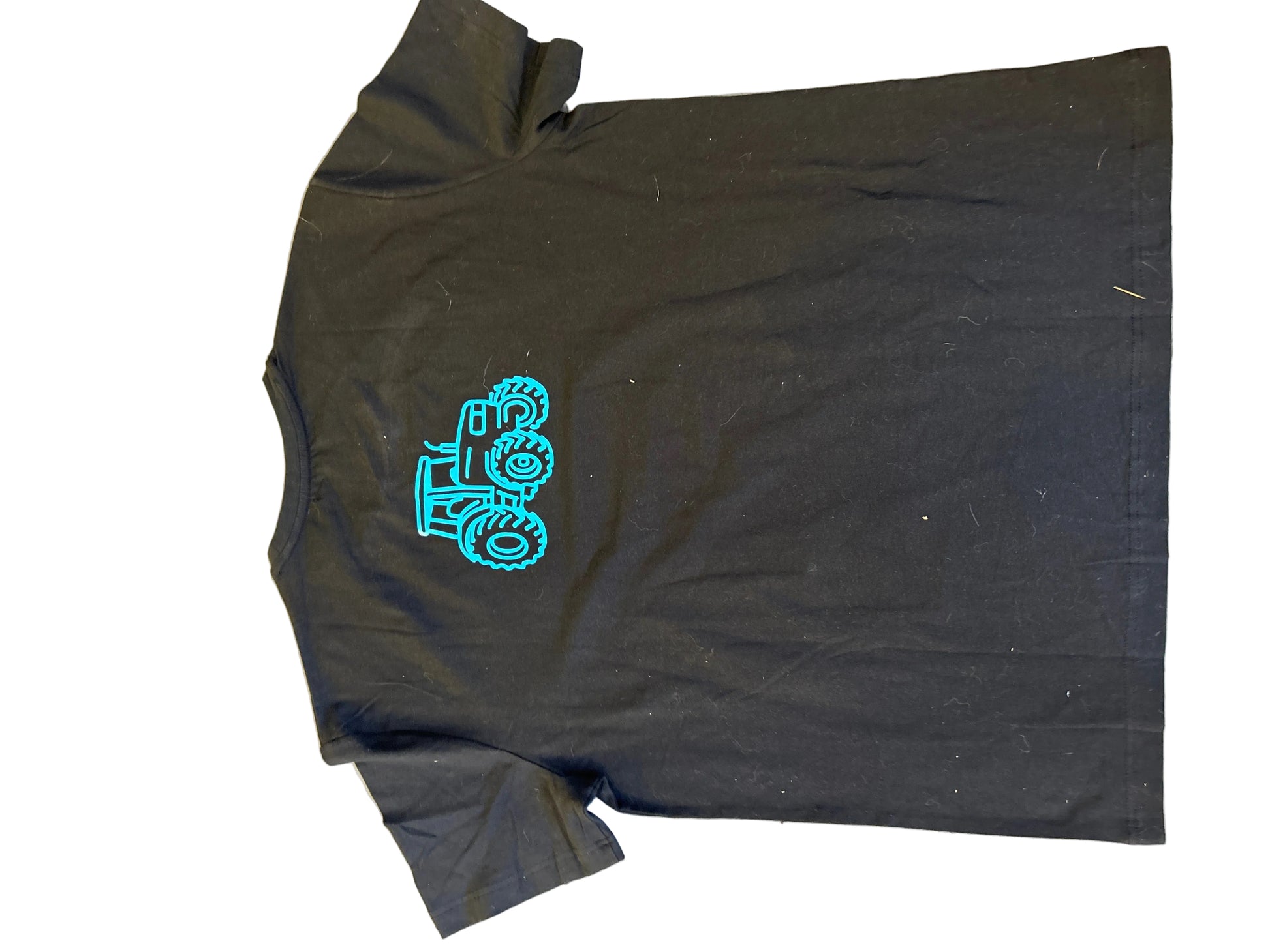 Black t-shirt with a blue graphic on a light gray surface