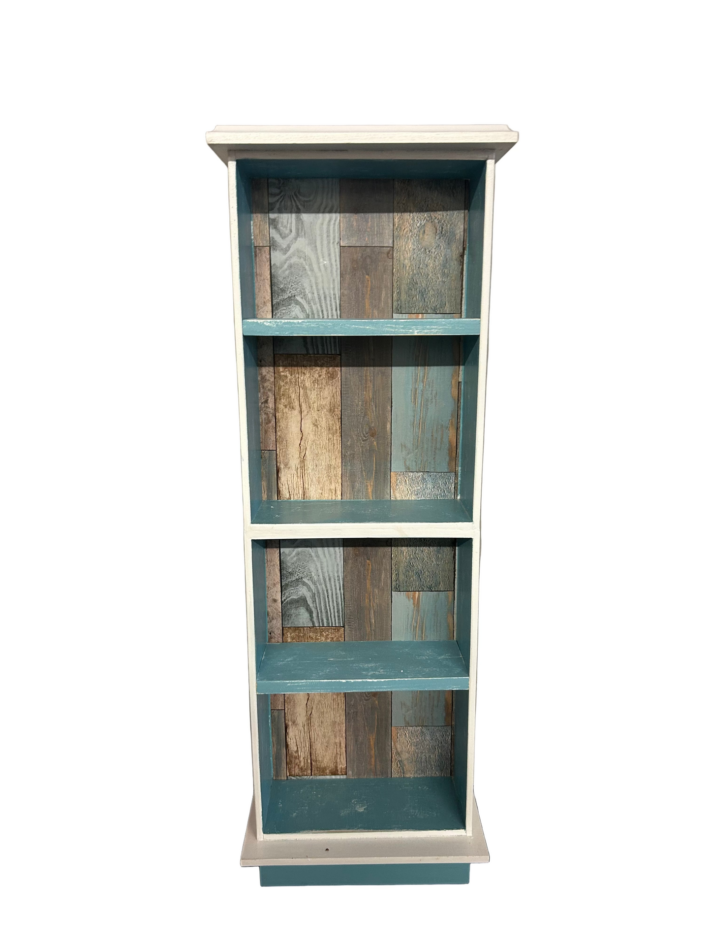 Wooden bookshelf with multicolored wooden panels on a plain wall.