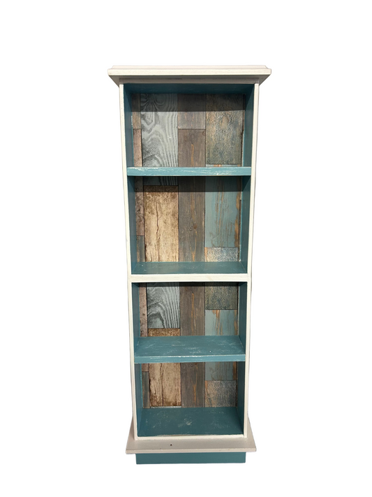 Wooden bookshelf with multicolored wooden panels on a plain wall.